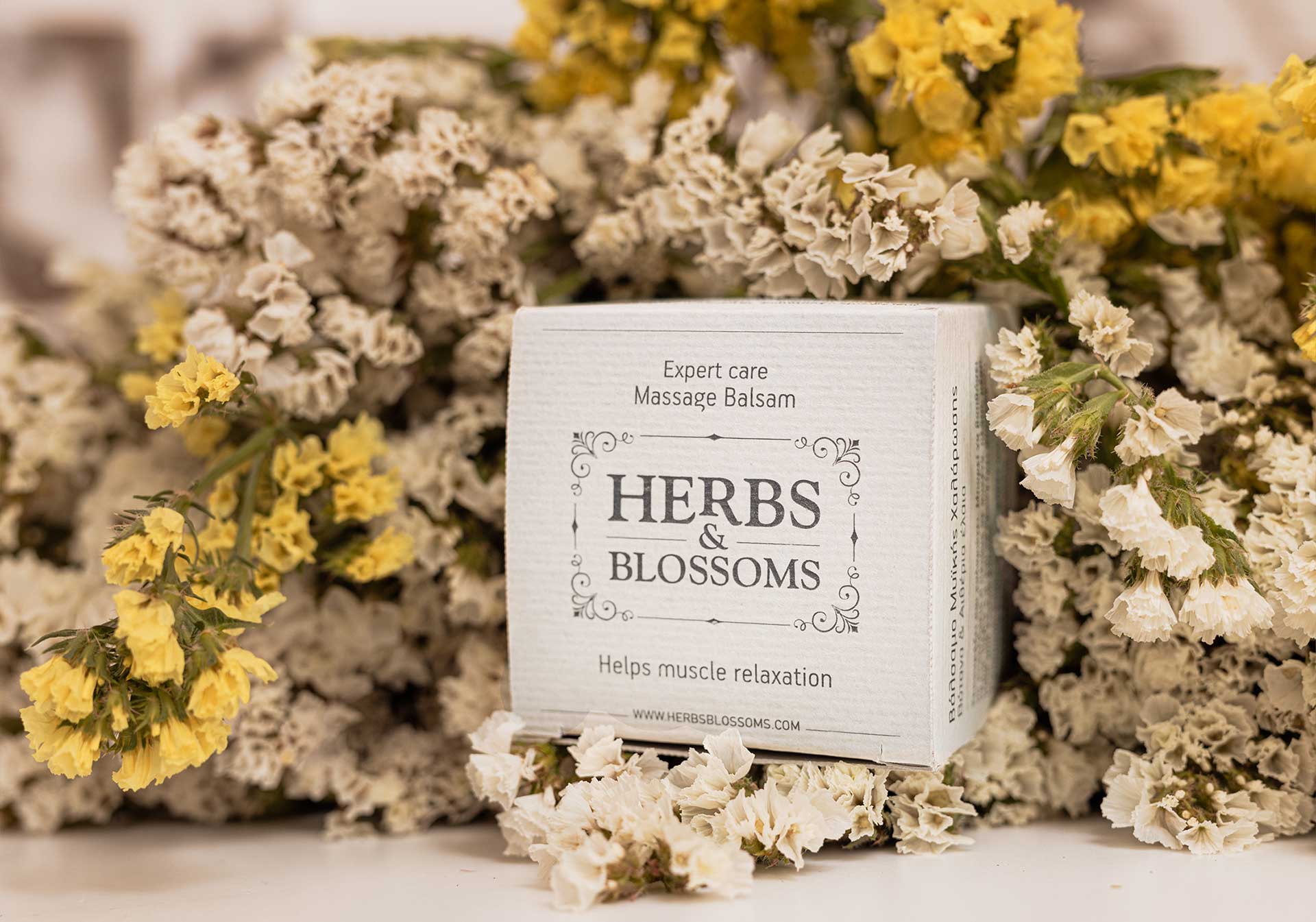 Box of Herbs & Blossoms Balsam among flowers